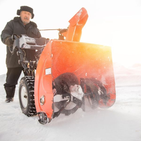 Man using snowblower
