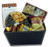 Gift basket arrangement filled with sweet and salty edibles, caramels, chocolate covered fruit, cookies, and nuts Gift basket arrangement filled with sweet and salty edibles, caramels, chocolate covered fruit, cookies, and nuts