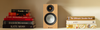 Monitor Audio Silver 50 7G Bookshelf Speakers (pair) in Ash, on a shelf