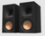 Klipsch R-60M Bookshelf Speakers in Ebony sold as a pair.  Image shown without grille and angled