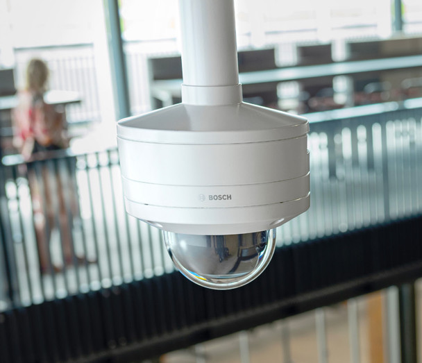 Bosch IQsight FLEXIDOME 8100i 8MP 4K HDR X PTRZ Dome IP Security Camera shown with pipe mount pendant mount optional accessory