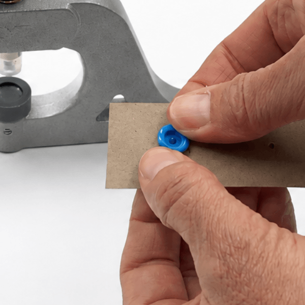 Positioning socket over plastic snap cap prong
