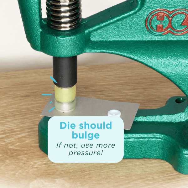 Pressing the handle to apply plastic snaps