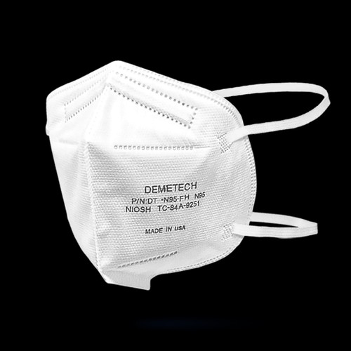 A white flat-fold Demetech DT-N95-FH respirator, shown unfolded, highlighting the five-layer construction and secure head straps.