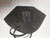A flat lay of a black Powecom KN95 mask, showcasing its foldable, portable design.