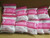 Stack of 10 pink Powecom KN95 respirator masks in their packaging.