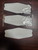 Close up image of several White Harley KN95 Respirator Face Mask