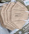 Khaki Powecom KN95 respirator mask with ear loops, 10 masks per pack, featuring the new GB2626-2019 standard.