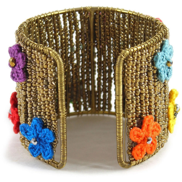 Seed beaded cuff decorated with crochet flower appliques. 2.125" W x 7.75L