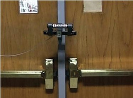 Shiffler Ultra Dog Door Security Bar for Double Outswing Door with Mullion - 5" Hook Centers Shiffler Shiffler Furniture and Equipment for Schools