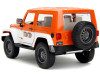 2007 Jeep Wrangler Orange Metallic and White and Orange M&M Diecast Figure "M&M's" "Hollywood Rides" Series 1/24 Diecast Model Car by Jada