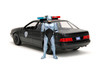 Ford Taurus OCP Matt Black "Detroit Police" and Robocop Diecast Figure 35th Anniversary "Robocop" (1987) Movie "Hollywood Rides" Series 1/24 Diecast Model Car by Jada