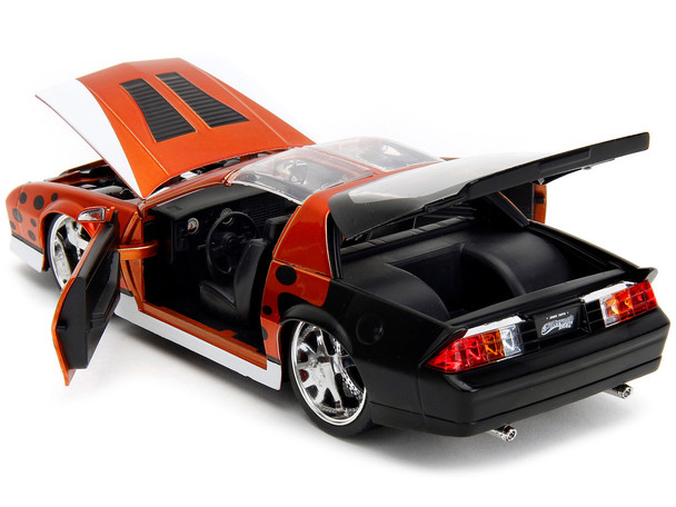 1985 Chevrolet Camaro Z/28 Orange Metallic with Graphics and Chester Cheetah Diecast Figure "Cheetos" "Hollywood Rides" Series 1/24 Diecast Model Car by Jada