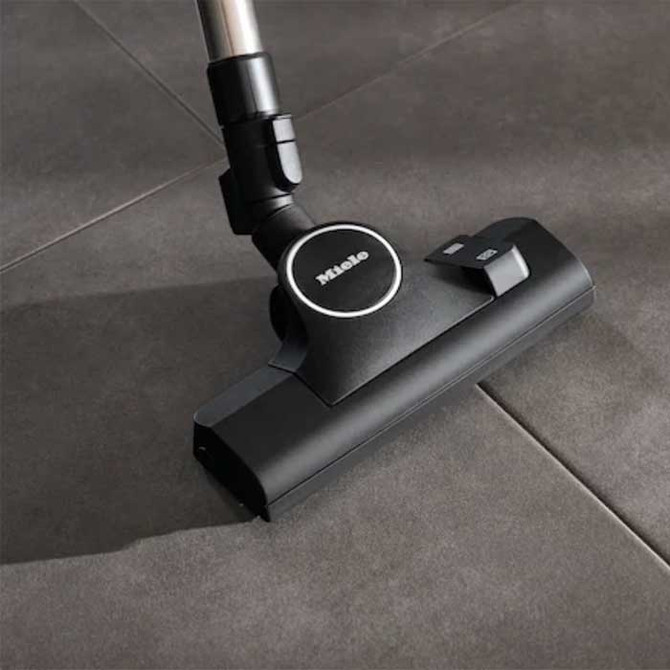 Combination tool for bare floors and flat carpet. 