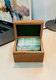 This hinged box includes laser engraving an image on it's top and felt lining in the inside. 
