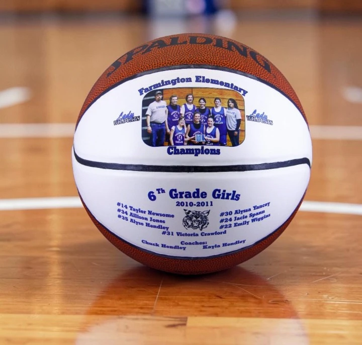 A photo of a commemorative Farmington Elementary Champions 6th grade girls basketball with a team roster printed by us in 2011.
