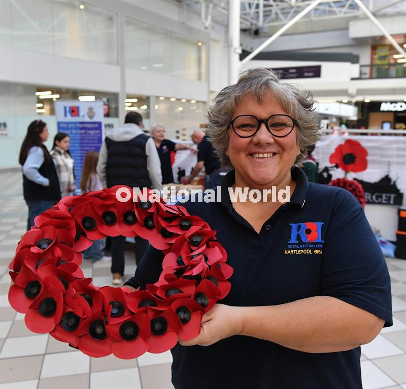 40398578-Sian Cameron Poppy Appeal Organiser with Poppy Wreath at the Royal  British Legion poppy stand in Middleton Grange Shopping Picture by 