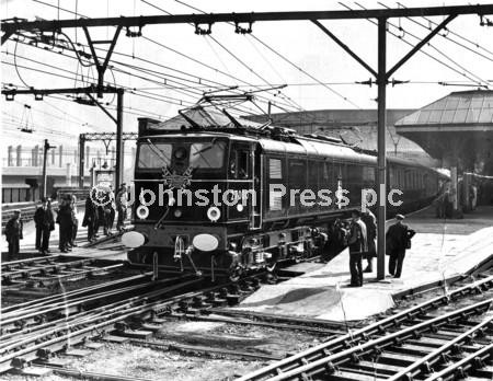 23875814-Sheffield, 14th September 1954 Victoria The first  electric train pulls into the Black and red locomotive 27000  Driver