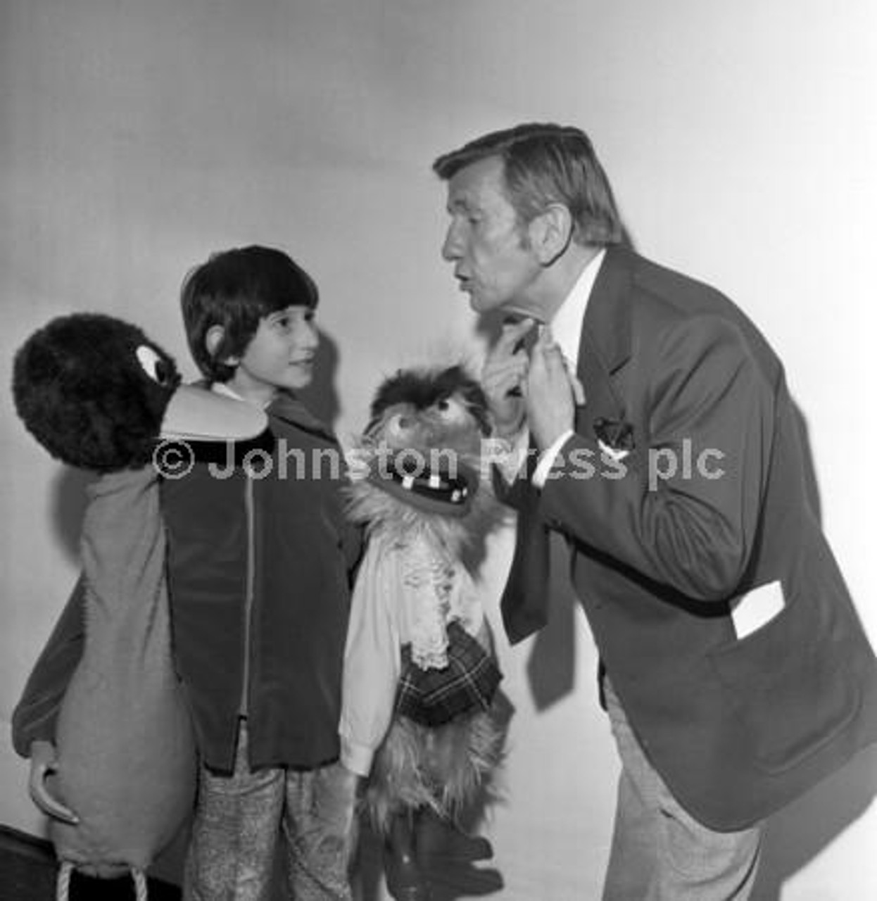 20242814-Young ventriloquist Malcolm Thompson gets some advice from  producer Colin Farnell at the BBC Crackerjack auditions in Edinburgh in  december 1976. - National World | Newsprints