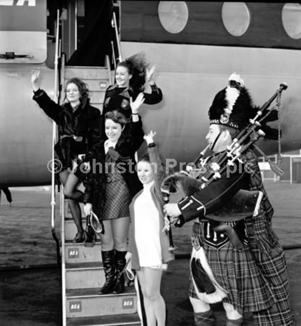 20364338 Four of Miss Brodie s gerls are piped aboard their plane in Edinburgh where parts of the film The Prime of Miss Jean Brodie were filmed in