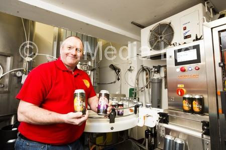 38963971Steve Hemingway with the new canning machine at Mill Valley