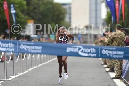 39115792-Womens race winner Hellen Obiri crossing the finish line at the  Great North Run 2021