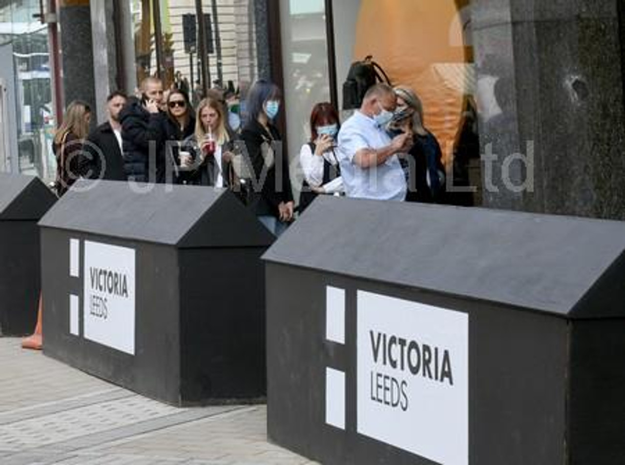 38950503-A queue for the Louis Vuitton in the Victoria Quarter in Leeds.