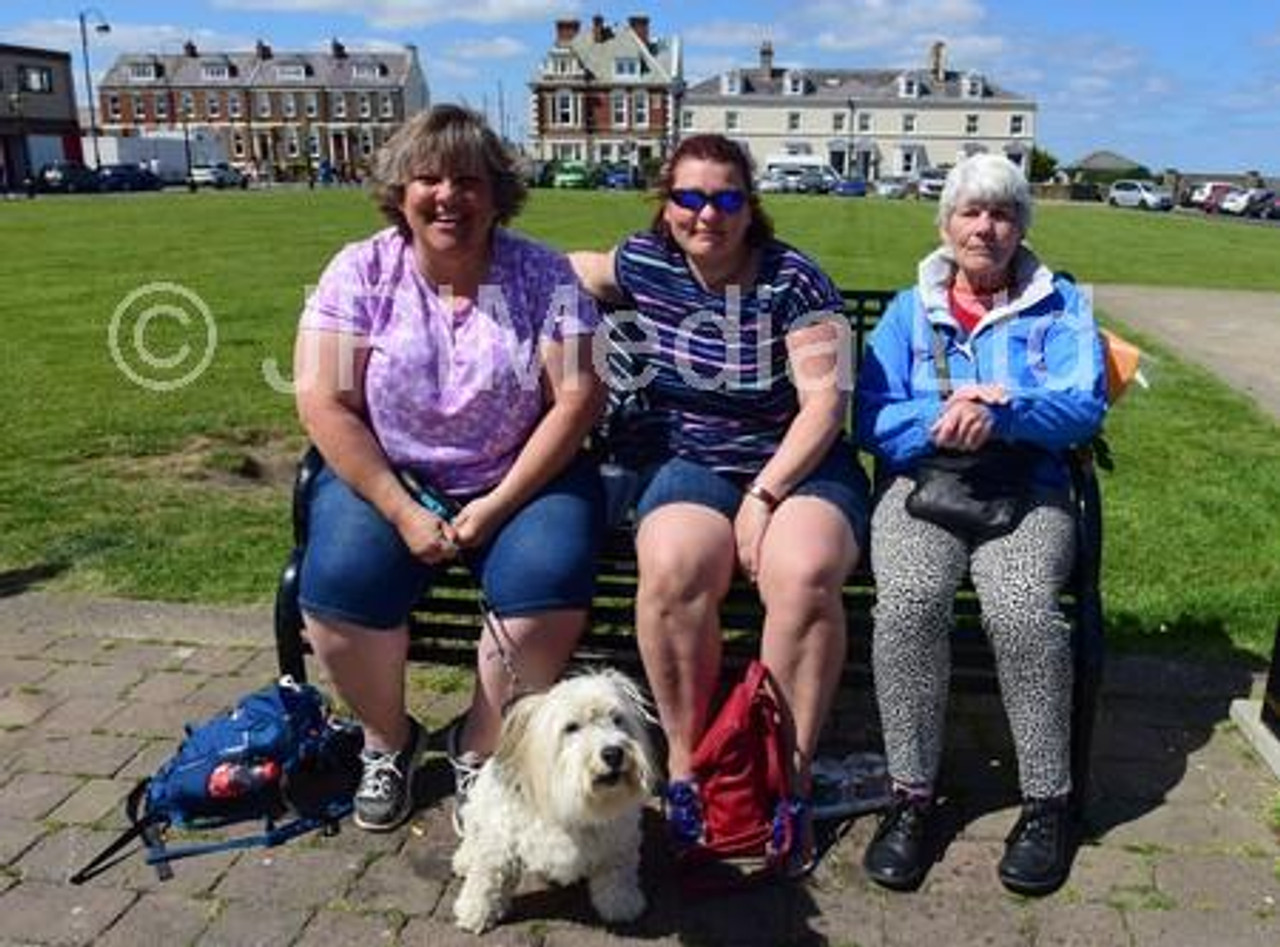 39010821 Sian Cameron of Hartlepool with friends from the Midlands Andrea Atkinson and Christine Atkinson enjoy the summer sun at Seaham on