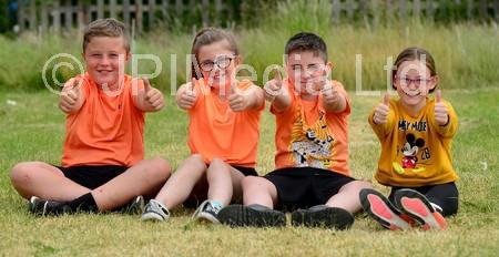 39025307-St Aidan s Primary school pupils left to right Logan Marshall,  Poppy McDonald, Frankie Sheehan and Millei Sowerby cheer on their fellow