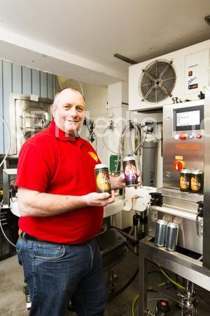 38907905Steve Hemingway with the new canning machine at Mill Valley
