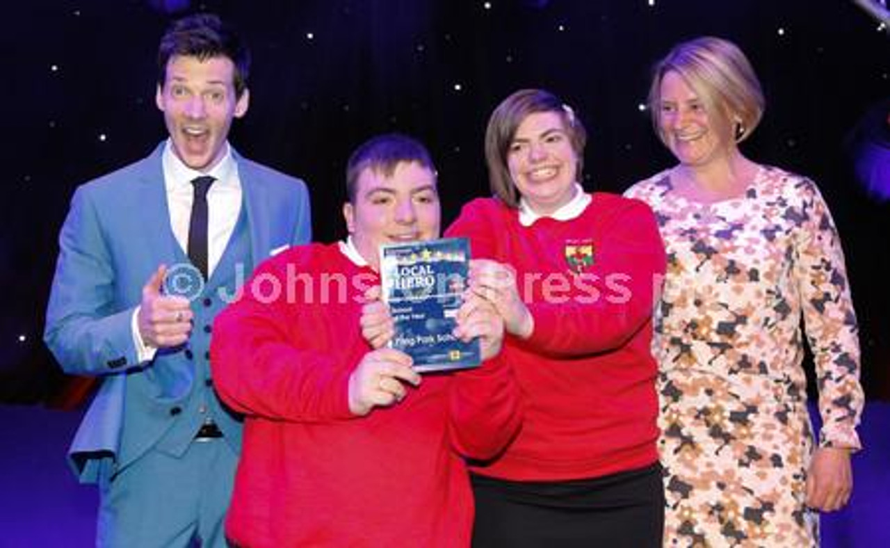 30784470 Head Boy Sam Paterson and Head Girl Fern Brodie of Pilrig Park School receive the School of the year award from Sarah Mitchell at The Local