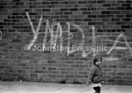 20235593Gang slogans painted on the wall in the heyday of the
