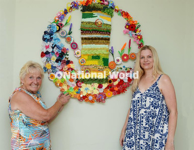 40352106-A new piece of textile artwork produced by groups, visitors ...