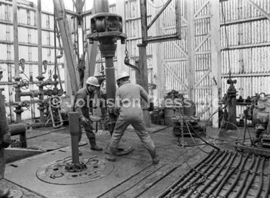 20235627-Men working on the drill on the Staflo oil rig in the North ...