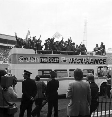 20244177-The Scotland World Cup squad wave to the football fans from