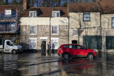 38884869-22 January 2021. . . . . Residents look at the flood water ...