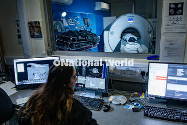 39899615-Alhamna Jabin - CT Radiographer scanning a body at Digital ...