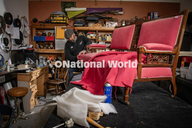 Michaela Reeves 40044733-Michaela Reeves partner Mark Skinner upholstering furniture in ...