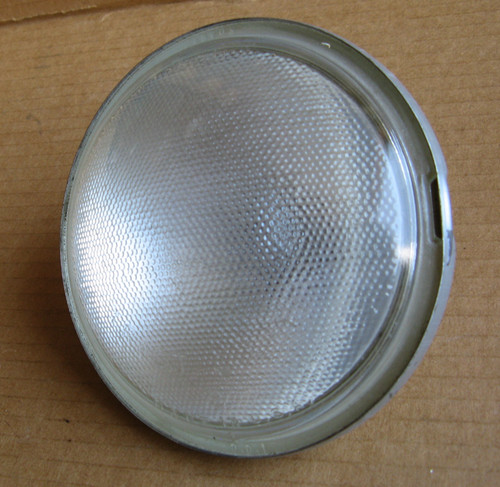 Bulb Light Clear. Dimpled Work light 12V 4-1/2" OD. "Ford" Stamped in glass at top of lens and at bottom "TRACT-O-LITE