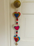 Short Felted Wool Heart Garland door