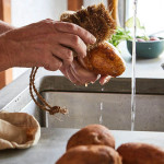 Tiger Veggie Brush used for scrubbing potatoes