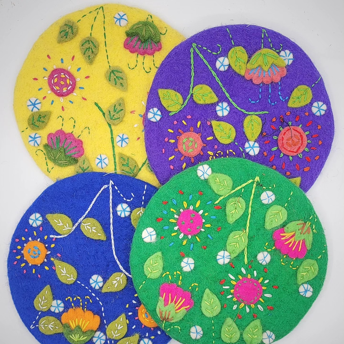 floral felted wool trivets in spring colors