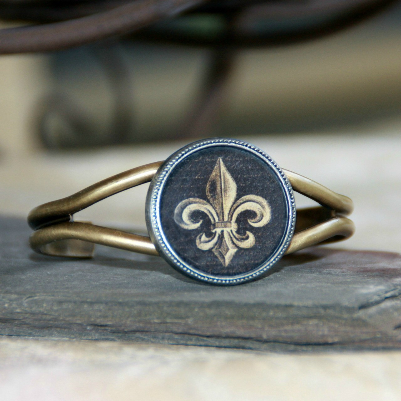 ART-121 Black and Gold Fleur de Lis Cuff Bracelet