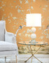 Lavena, printed wallpaper mural by Paul Montgomery. Orange chinoiserie in room.