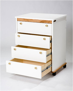 The Tracey Stables Cutting Table Hide-A-Way offers a 26½" x 20" storage unit with full-extension drawers, available in multiple finishes and adjustable heights.
