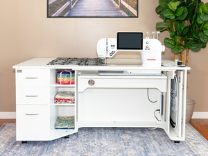 Horn of America Model 9080 Sewing Cabinet featuring a 34" x 15½" machine cut-out, expandable work surface, embroidery hoop pull-out, and soft-close drawers. Horn of America Model 9080 Sewing Cabinet featuring a 34" x 15½" machine cut-out, expandable work surface, embroidery hoop pull-out, and soft-close drawers.