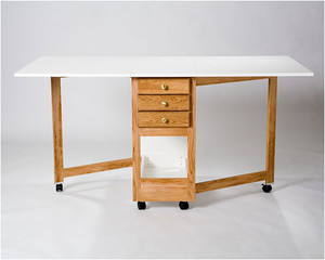 Tracey's tables Three Drawer Cutting Table with a 72" x 40" open workspace, three 26" drawers, available in multiple finishes. Tracey's tables Three Drawer Cutting Table with a 72" x 40" open workspace, three 26" drawers, available in multiple finishes.