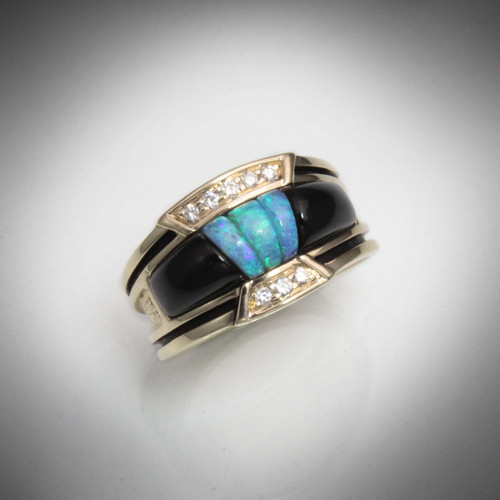 R 801 bg had  Black Jade surrounding blue-green Australian Opal with Pave' Diamonds and a black oxidation line.