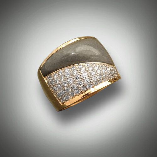 R 996 features a warm gray Jasper complimented by a full 1.00 carat of pave' set fine white Diamonds.