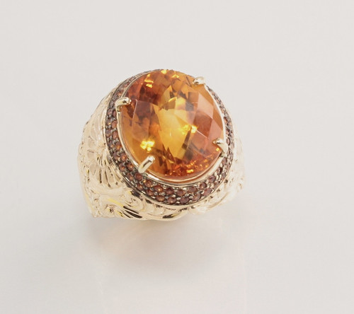 R 1178 has a 16mm oval Citrine with checkerboard face set with two rows of yellow sapphires in 14 kt yellow gold.  Weight 17 grams. 